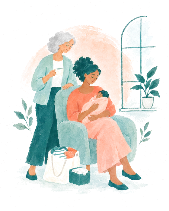 A mother holding her newborn in a soft armchair, an older woman standing behind her with a cup of tea